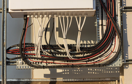 electrical cable management system, within an outdoor telecommunications or industrial cabinet