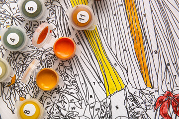 Obraz premium Paints on unfinished canvas for painting by numbers, closeup