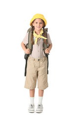 Little girl scout with backpack on white background. World Scout Day