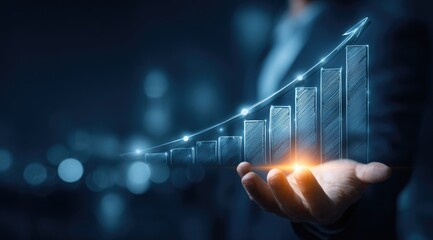 Hand holding a glowing digital financial growth chart with upward trend