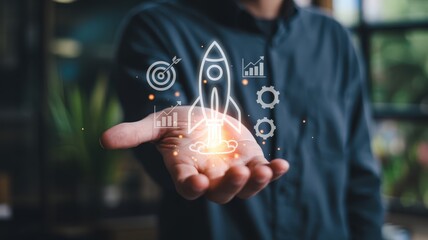 Person presenting glowing digital icons representing launch and business growth concepts above an open hand