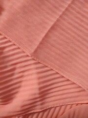 background and pattern of plain pink fabric with striped motif