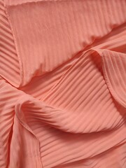 background and pattern of plain pink fabric with striped motif