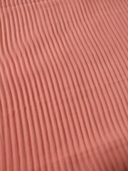 background and pattern of plain pink fabric with striped motif