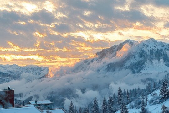 Snow-covered mountain village with evergreen pines, low mist and clouds, golden sunrise sky casting warm light over rugged peaks, serene and dramatic winter landscape - Powered by Adobe