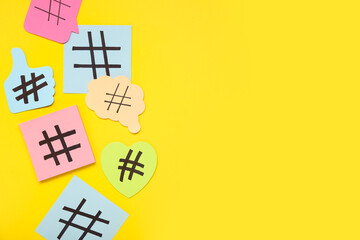 Sticky notes with hashtags on yellow background