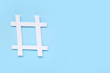 Obraz premium Hashtag made of paper on blue background
