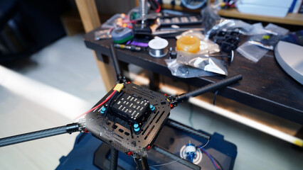 Electric technician’s workstation with tools and drone repair equipment