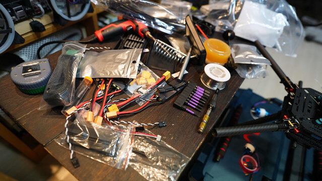 Electrician’s workspace with tools and wires for maintenance and repair - Powered by Adobe