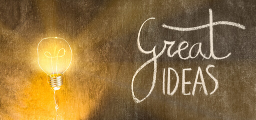 Great ideas concept light bulb illuminated on dark chalk board surface design