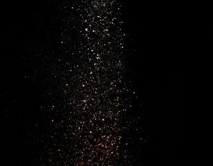 黒い背景に細かい粒子の光が舞っている背景