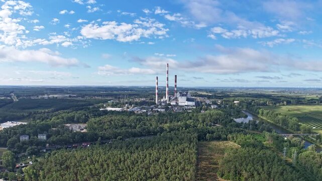Time-lapse of fast-moving clouds and smoke over the Dolna Odra Power Plant - the largest gas power plant in Poland