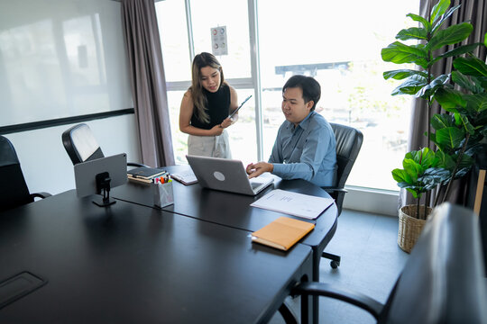 Young Business Professionals Collaborating on a Business Project in a Meeting Room.