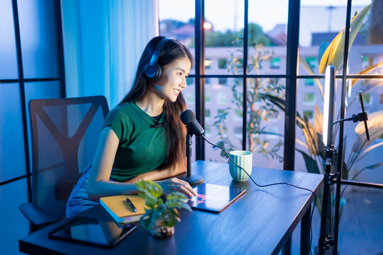 Content creator Young asian woman influencer creating content in home studio entertainment and communication blogger video record with smartphone for online vlog - Powered by Adobe