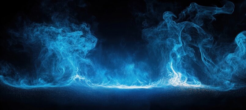 Mystical swirling blue smoke or mist rising against a black background with glowing and intricate fluid patterns