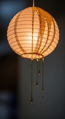 Obraz premium Illuminated spherical lantern shows thick amber substance dripping from the top surface