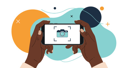 Dark-skinned hands holding a smartphone horizontally, displaying a camera app interface with a focus frame, against an abstract background.
