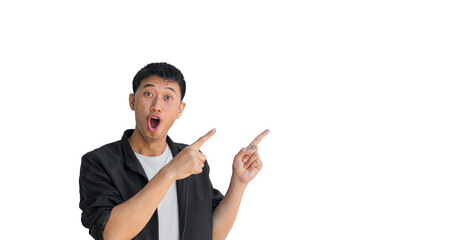 A young Asian man wearing black coat happy shocked face pointing thumbs up isolated on a white background. The person's index finger pointing to a blank space for text. Thai man.
