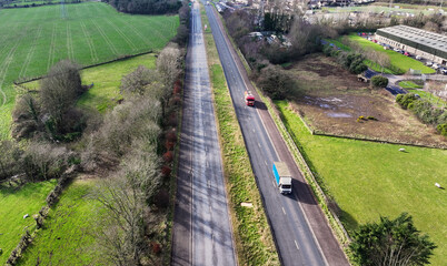 Aerial view of vehicles driving on a Dual carriageway in UK