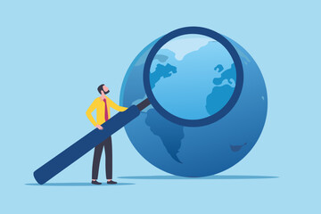 Global analysis man examining the world with magnifying glass © Ripan