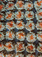 Fresh Dim Sum Filling with Wonton Wrappers and Carrot Topping