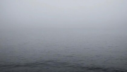 Vast Ocean Surface Blanketed by Serene Haze, Where the Mysterious Horizon Blurs Seamlessly into a Misty Sky, Evoking Calm and Tranquility