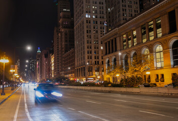 City night illuminated building. Skyscraper cityscape. Night city of Chicago. Business city. Night cityscape of Chicago skyscraper building. Chicago architecture of skyscraper. Urban nightscape