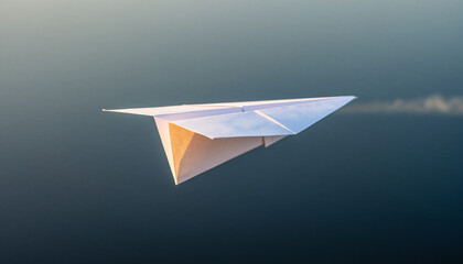 Paper airplane flying through the air with a trail behind it.