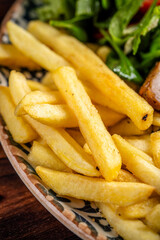 Golden crispy french fries close-up