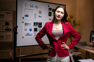 Confident asian businesswoman presenting business data charts in office