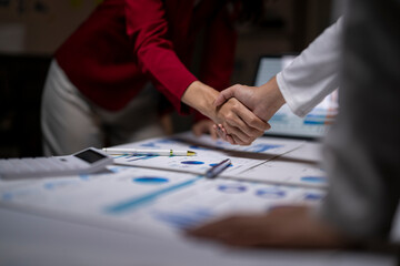 Businesswomen shaking hands after successful partnership agreement