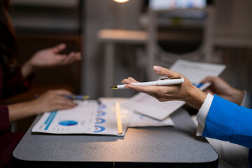 Business people discussing financial data during office meeting