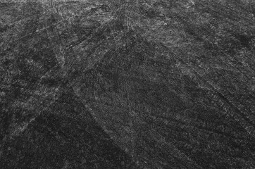 Close up black tire marks on cement floor.