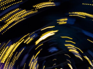 Neon light circular motion blur abstract background. Abstract blue and yellow lights trail on the dark background