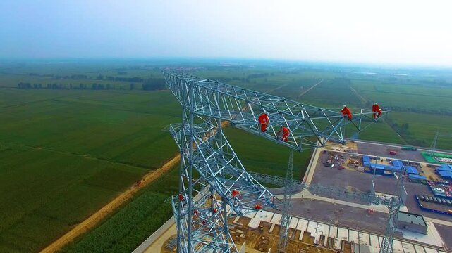High Voltage Tower Commissioning - Workers on 127kV Electrical Transmission Line