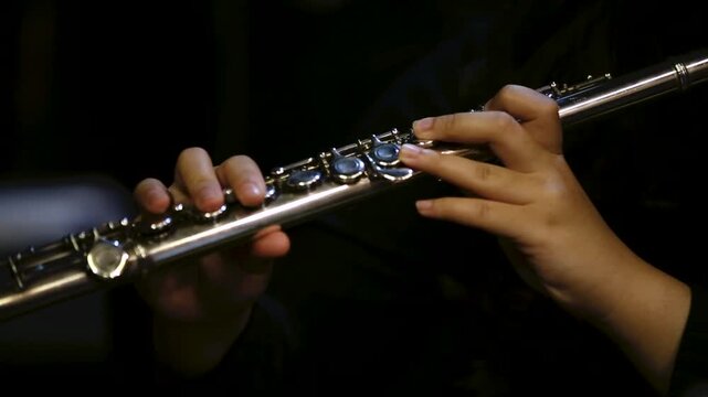 Close Up of Musician Playing Silver Flute