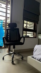 Ergonomic Office Chair in Modern Bedroom with Balcony View
