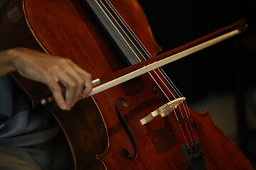 Close up of Musician Playing Cello with Bow in rehearsal studio © maha