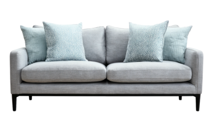 A modern light gray sofa with four decorative pillows