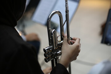 Fototapeta premium Closeup of Trumpet Player Practicing in a Music Rehearsal Room