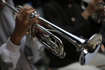 Obraz premium Closeup of Trumpet Player Practicing in a Music Rehearsal Room