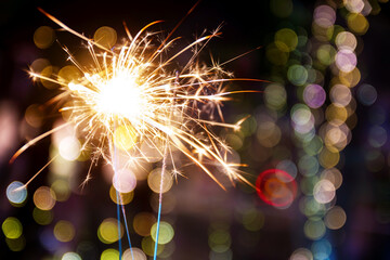 beautiful bokeh of christmas sparkler, holiday background and happy new year creating festive atmosphere for celebration or holiday event