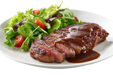 Sliced grilled steak with gravy and a side salad