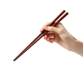 Hand holding dark wooden chopsticks against black background