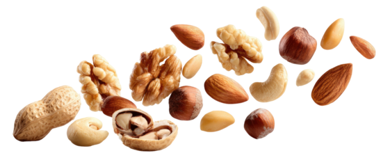 Assortment of nuts and kernels scattered across a dark background