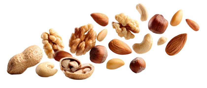 Assortment of nuts and kernels scattered across a dark background