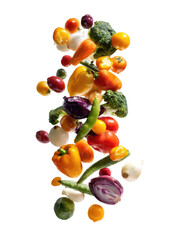 Assortment of colorful vegetables falling through the air