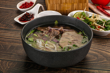 Vietnamese Pho Bo soup with beef and noodles