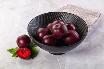 Raw ripe purple plum heap