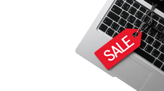 Red Sale Tag on Laptop Keyboard Isolated on White Background